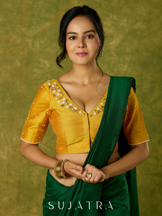 Beautifully hand embroidered light yellow cotton silk blouse for festivals.