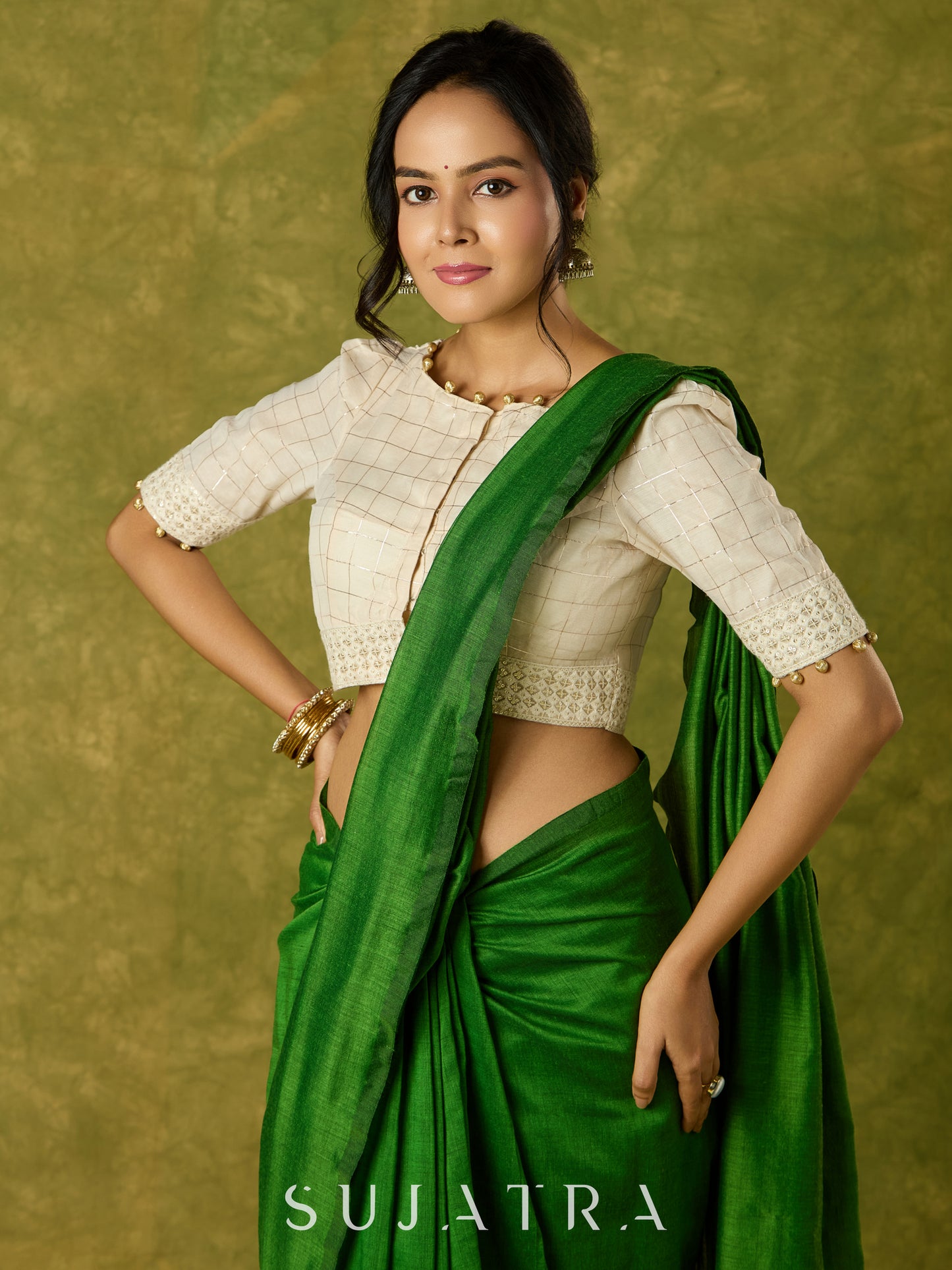 Elegant off-white chanderi blouse beautifully highlighted with delicate lace