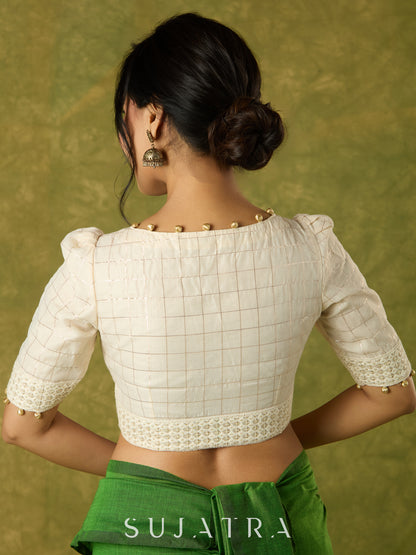 Elegant off-white chanderi blouse beautifully highlighted with delicate lace