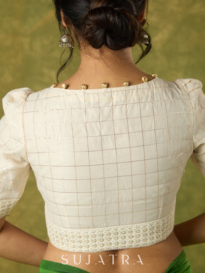 Elegant off-white chanderi blouse beautifully highlighted with delicate lace