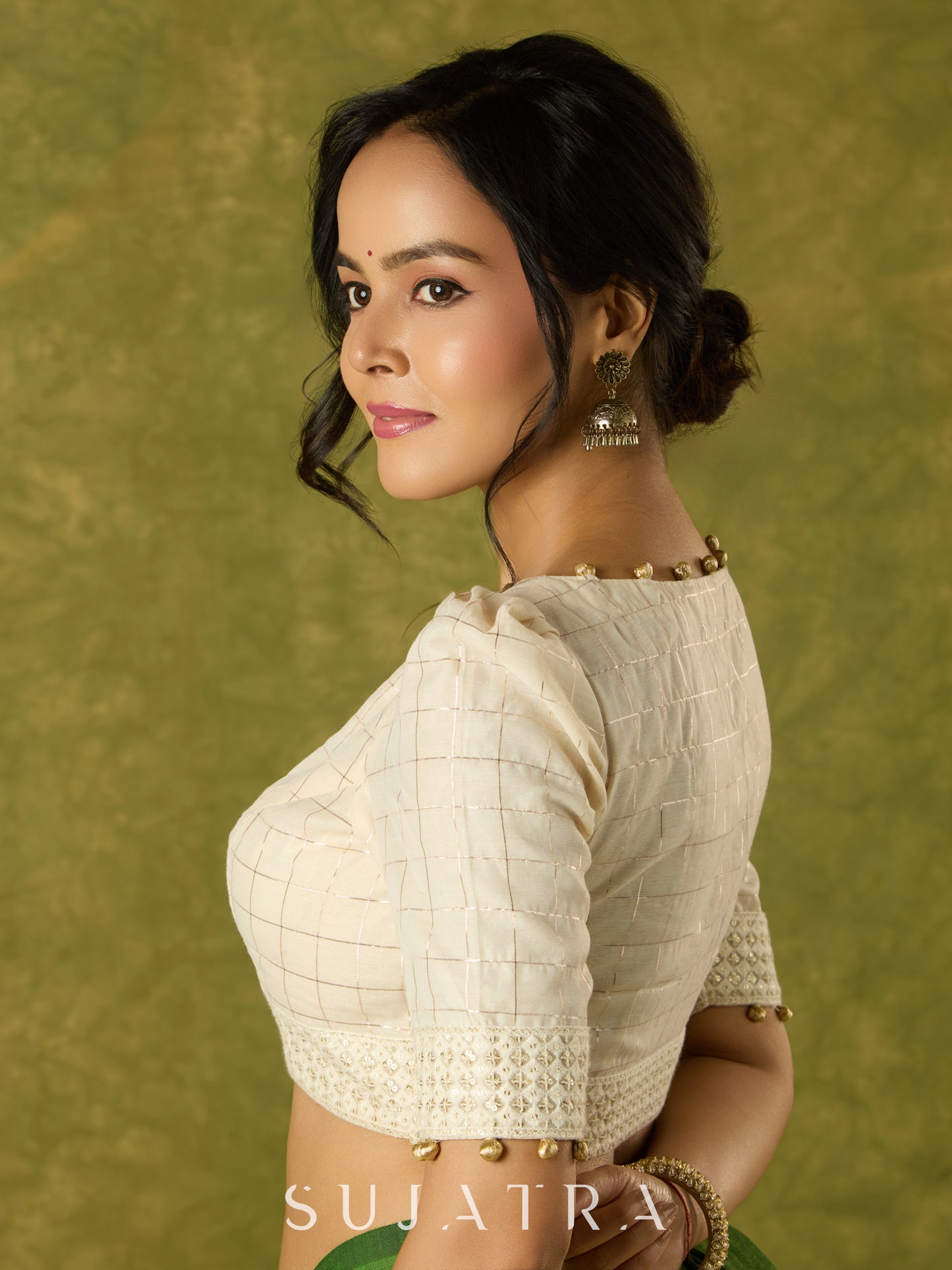 Elegant off-white chanderi blouse beautifully highlighted with delicate lace
