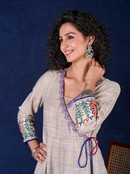 Artisanal Beige Handloom Cotton Angarkha Long Gown with Madhubani Border Embellished Neckline, Sleeve & Flare, with Vibrant Statement Tassels