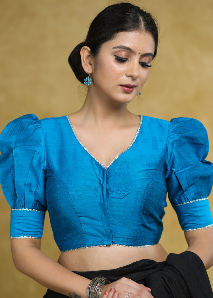 Striking Firozi Blue Puff Sleeves Elbow Length Blouse with Silver Detailing