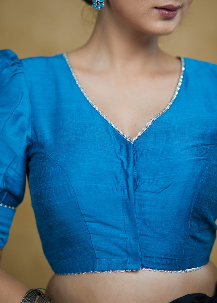 Striking Firozi Blue Puff Sleeves Elbow Length Blouse with Silver Detailing