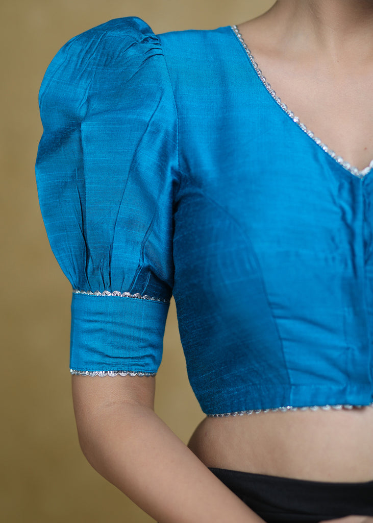 Striking Firozi Blue Puff Sleeves Elbow Length Blouse with Silver Detailing