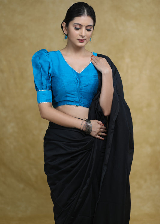 Striking Firozi Blue Puff Sleeves Elbow Length Blouse with Silver Detailing