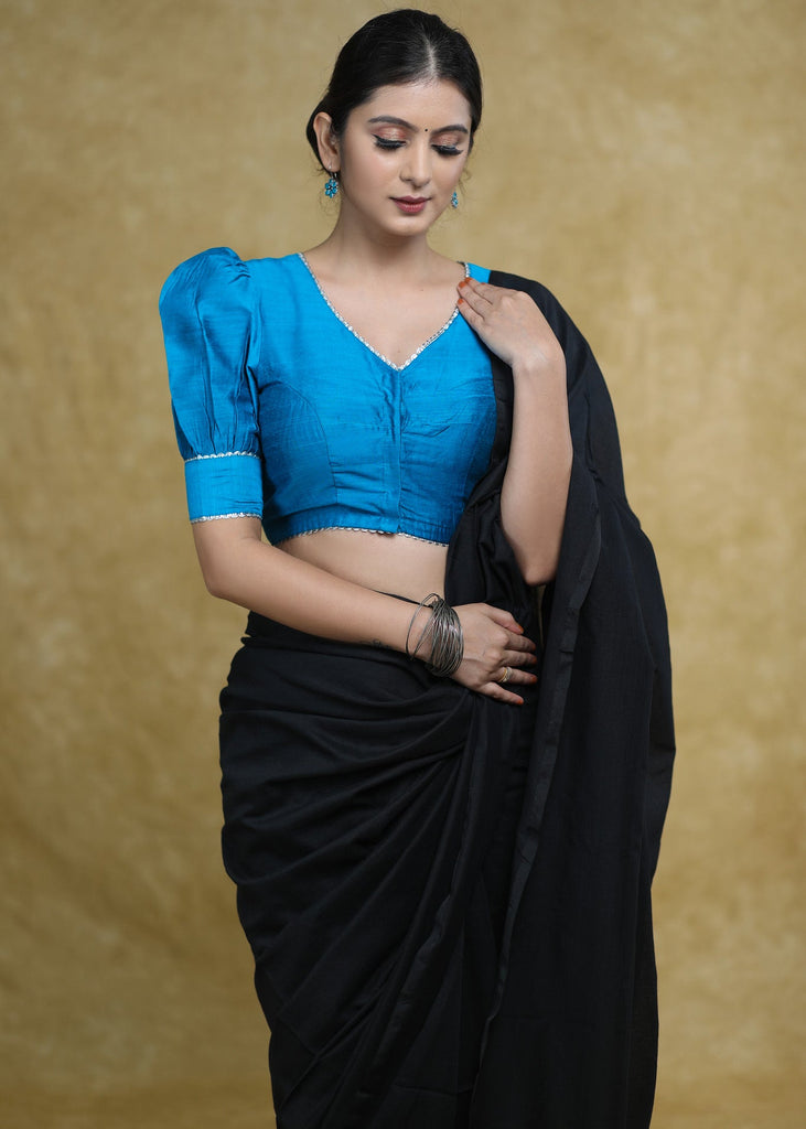 Striking Firozi Blue Puff Sleeves Elbow Length Blouse with Silver Detailing