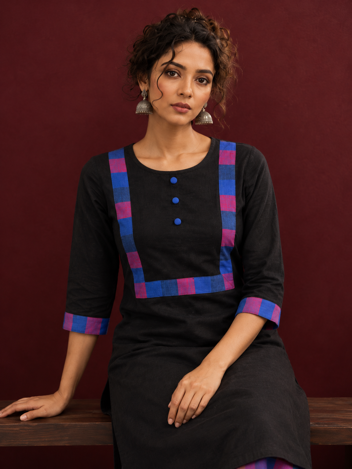 Timeless Black Cotton Kurta with Contrast Checkered Yoke Panel — seated detail — view 6
