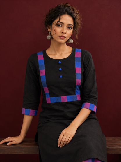Timeless Black Cotton Kurta with Contrast Checkered Yoke Panel — seated detail