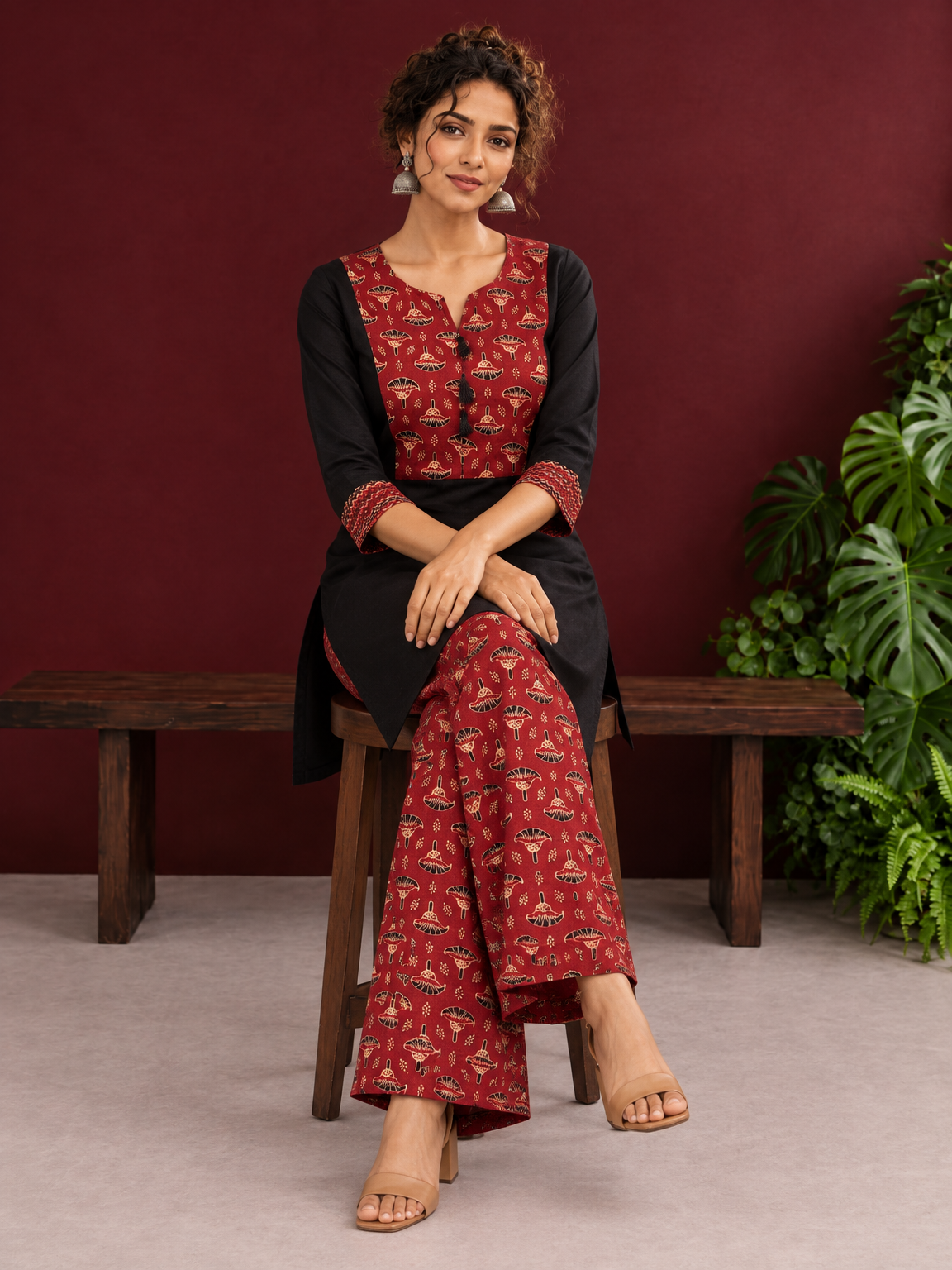 Classic Black Cotton Kurta with Maroon Ajrakh Print Yoke & Coordinated Sleeve Cuffs — seated — view 6