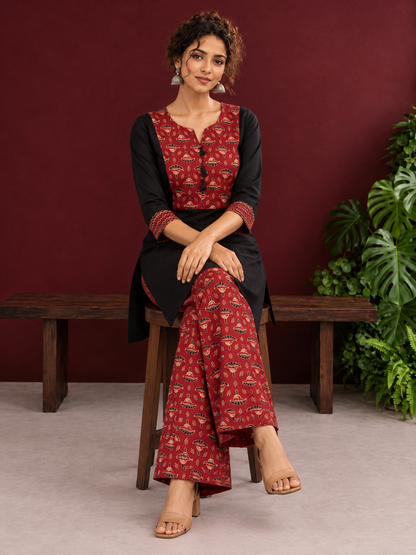 Classic Black Cotton Kurta with Maroon Ajrakh Print Yoke & Coordinated Sleeve Cuffs — seated