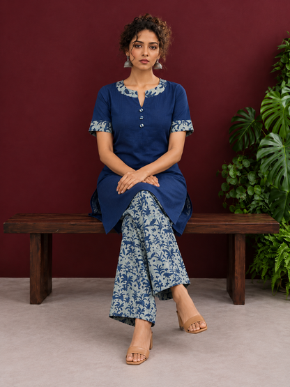 Navy Blue Cotton Kurta with Floral Printed Neckline and Sleeve Cuffs — seated