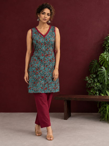 Teal Green Cotton Sleeveless Tunic with Floral Print, Maroon V-Neck Trim & Side Tie-Up Knots — front view