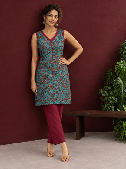 Teal Green Cotton Sleeveless Tunic with Floral Print, Maroon V-Neck Trim & Side Tie-Up Knots — side view