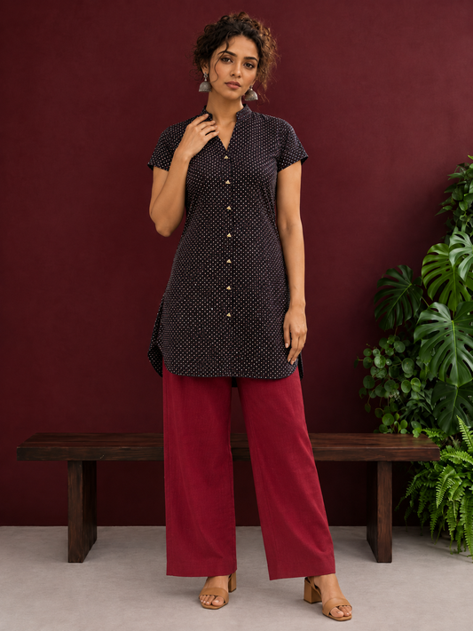 Timeless Black Cotton Tunic with Maroon Polka Dot Print and Gold Triangle Button Placket — front view