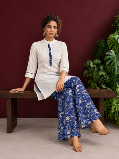 Timeless Off-White Cotton Kurta with Contrast Indigo Floral Print Placket — seated