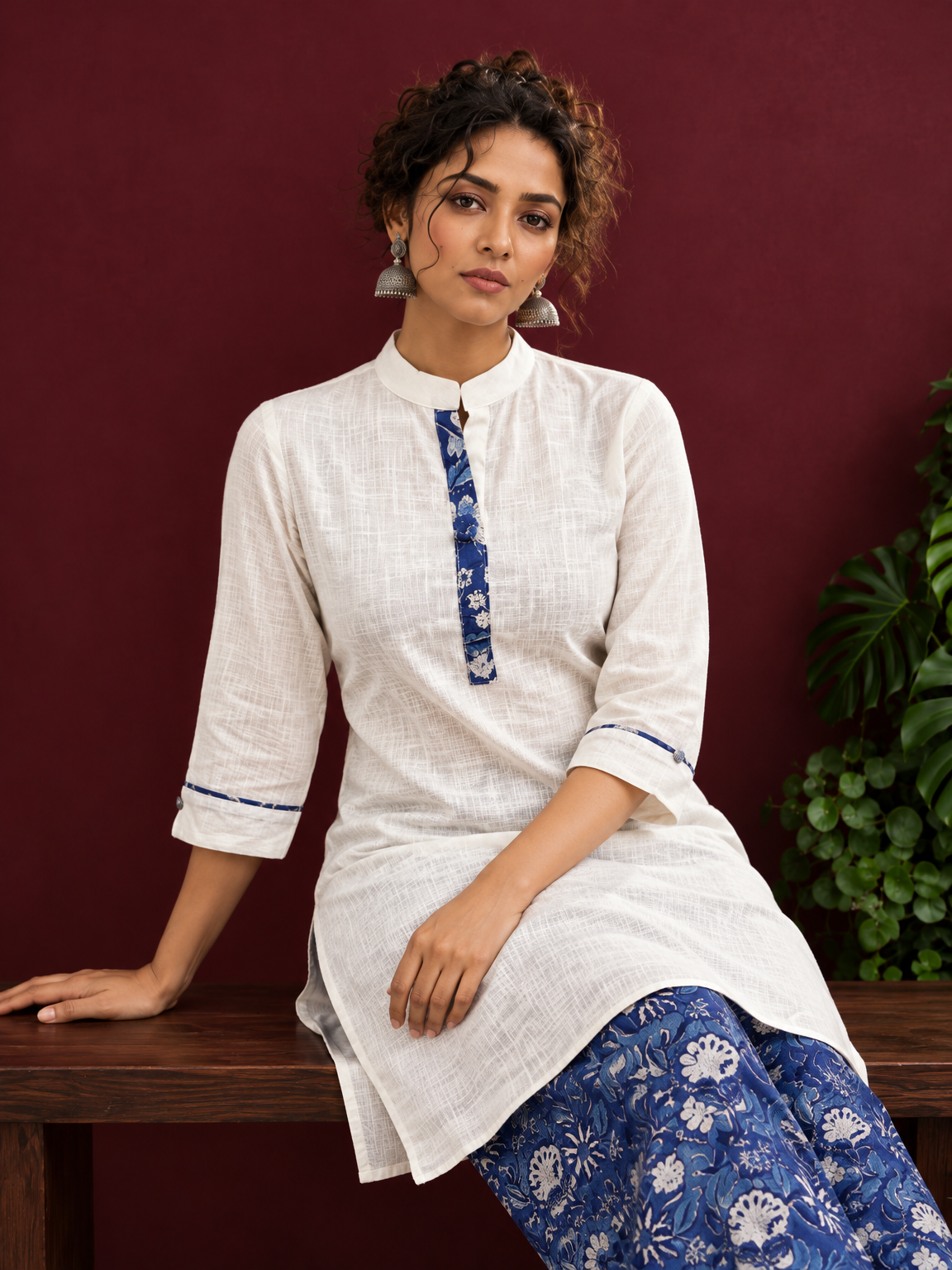 Timeless Off-White Cotton Kurta with Contrast Indigo Floral Print Placket — seated detail — view 7