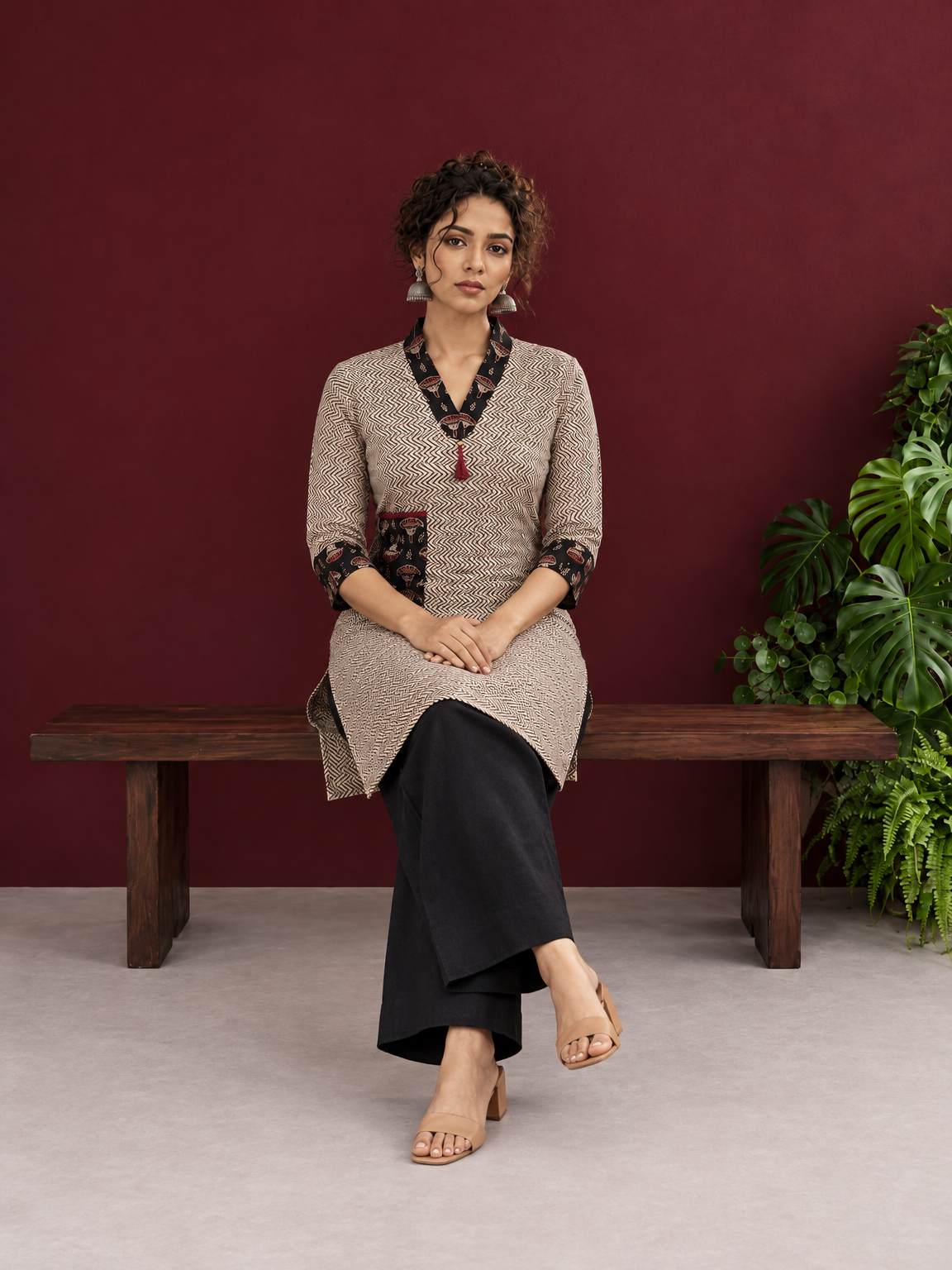 Elegant Beige Cotton Ajrakh Tunic with Contrast V-Neck & Cuff Detailing — seated — view 6