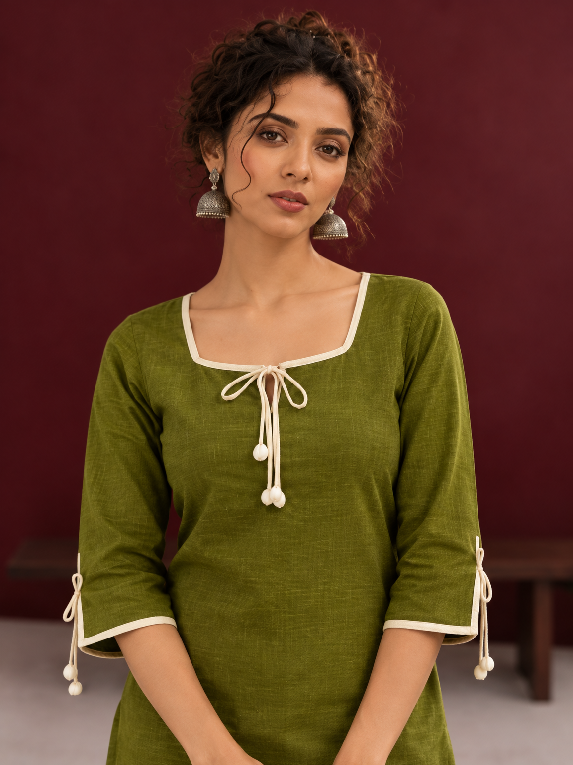 Timeless Olive Green Cotton Tunic with Tasseled Tie-Up Neckline and Contrast Lace Hem Border — fabric detail — view 3