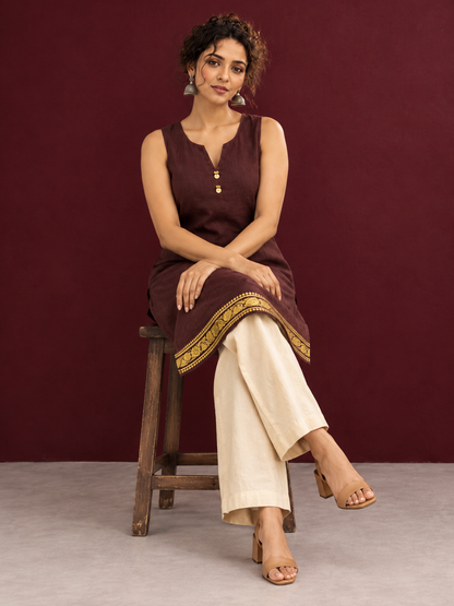 Elegant Brown Cotton Silk Sleeveless Kurta with Gold Zari Border and Notched Neckline — seated