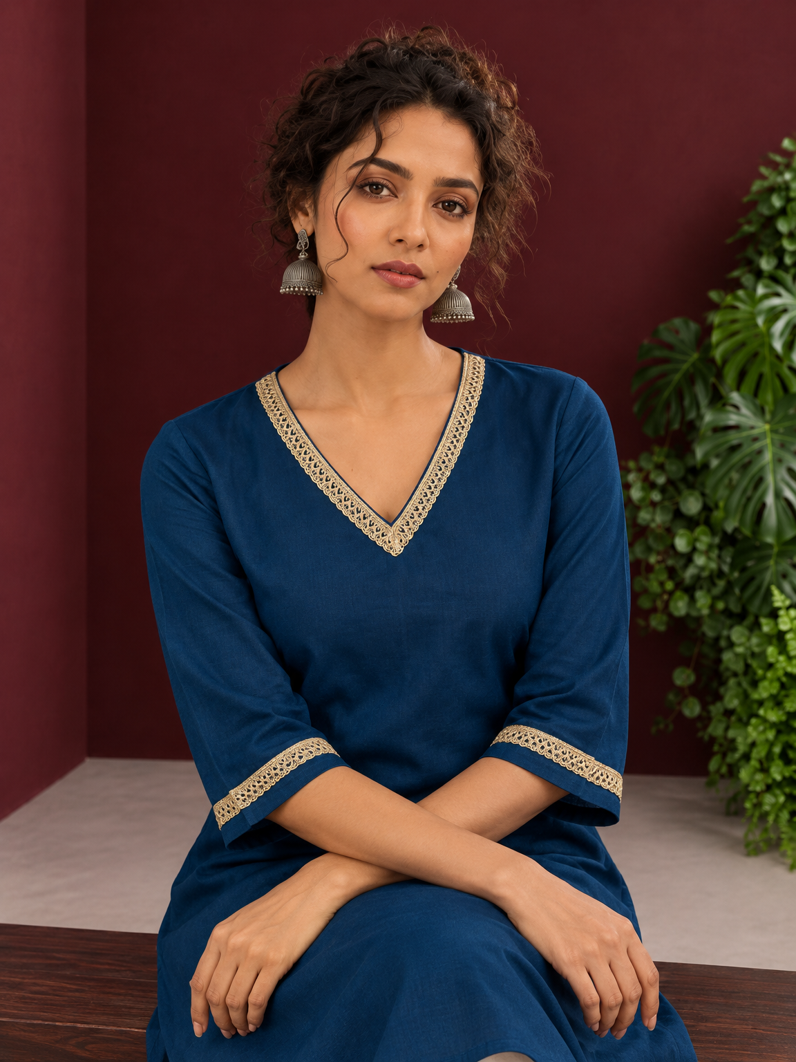 Elegant Teal Blue Cotton Tunic with Embellished Gold Lace V-Neckline and Matching Sleeve Cuffs — seated detail — view 6