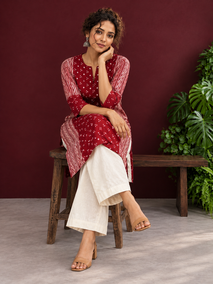 Maroon Rayon Tunic with Bandhani Dot Print Front Panel and Contrast Wavy Striped Sleeves & Side Panels — seated