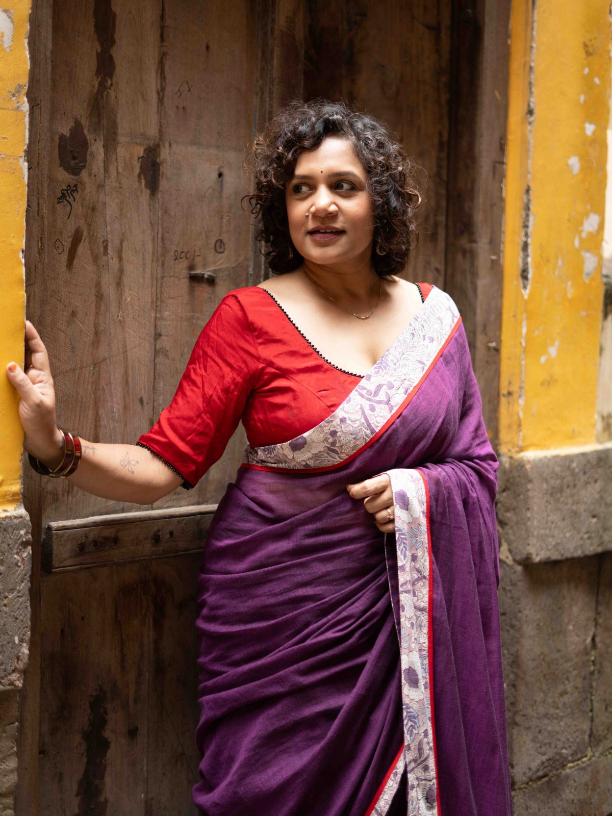 Ethereal Dual-Tone Purple Mul Cotton Saree with Floral Border, Red Tassel Highlights & Intricate Embroidered Pallu