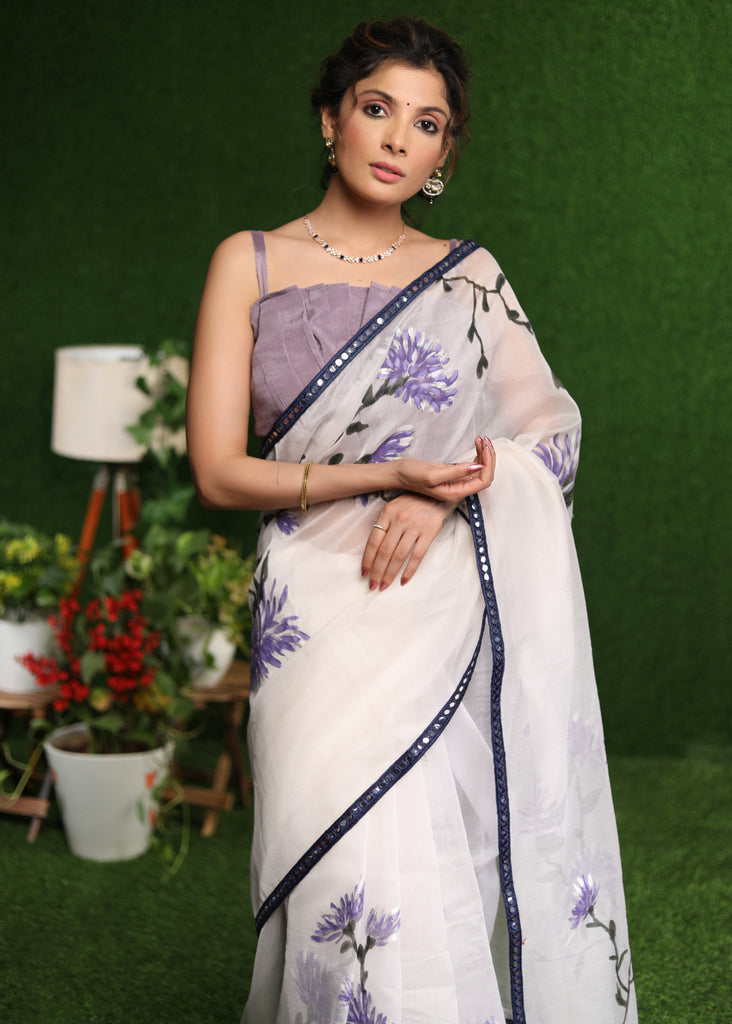 Designer white saree with lavender hand painting and Mirror work border