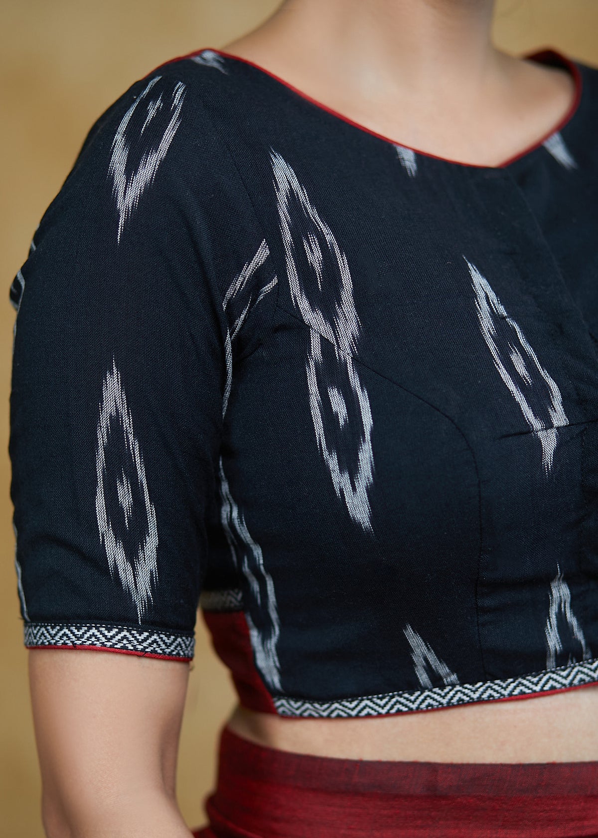 Elegant Black Cotton Ikaat Blouse with Elbow Length Sleeves &Maroon Detailing at the Back