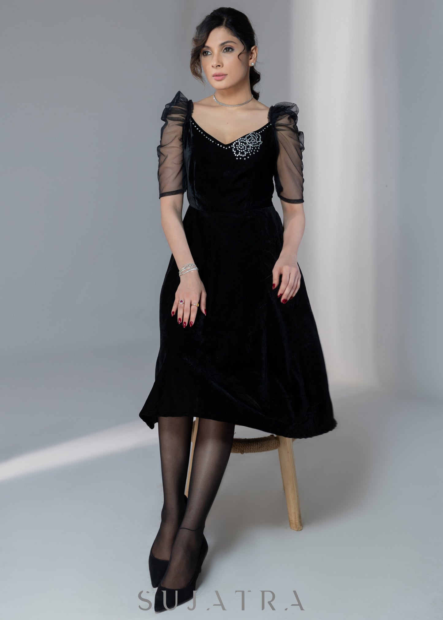Exclusive black velvet dress with net sleeves & stone work on neckline Sujatra Exclusive black velvet dress with net sleeves & stone work on neckline Sujatra