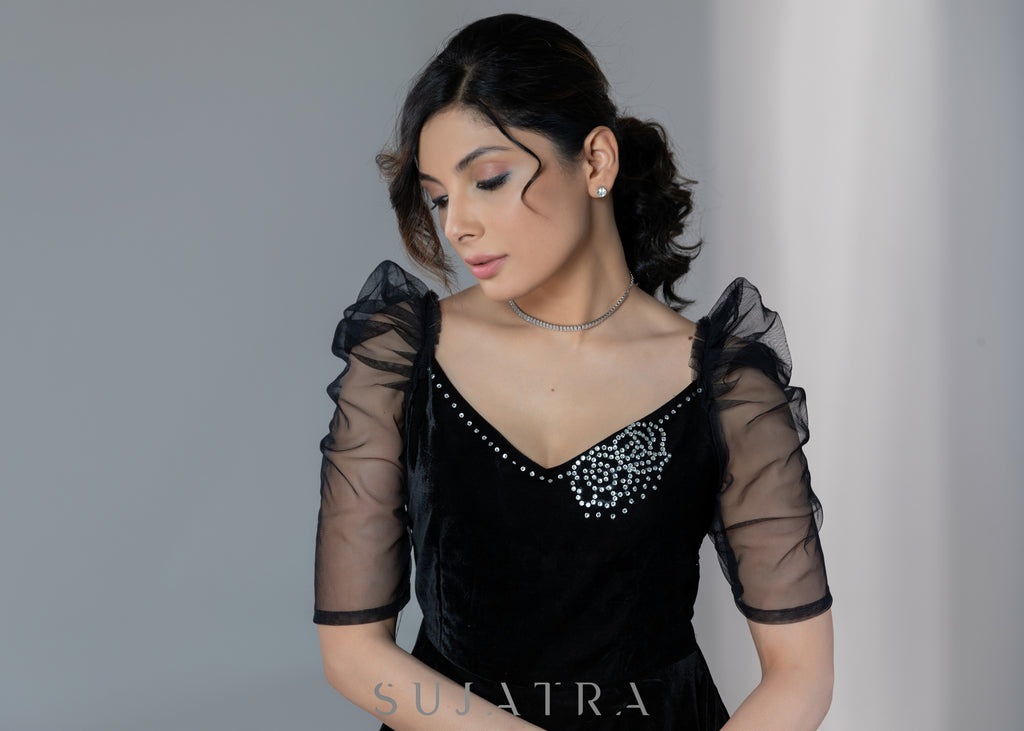Exclusive black velvet dress with net sleeves & stone work on neckline