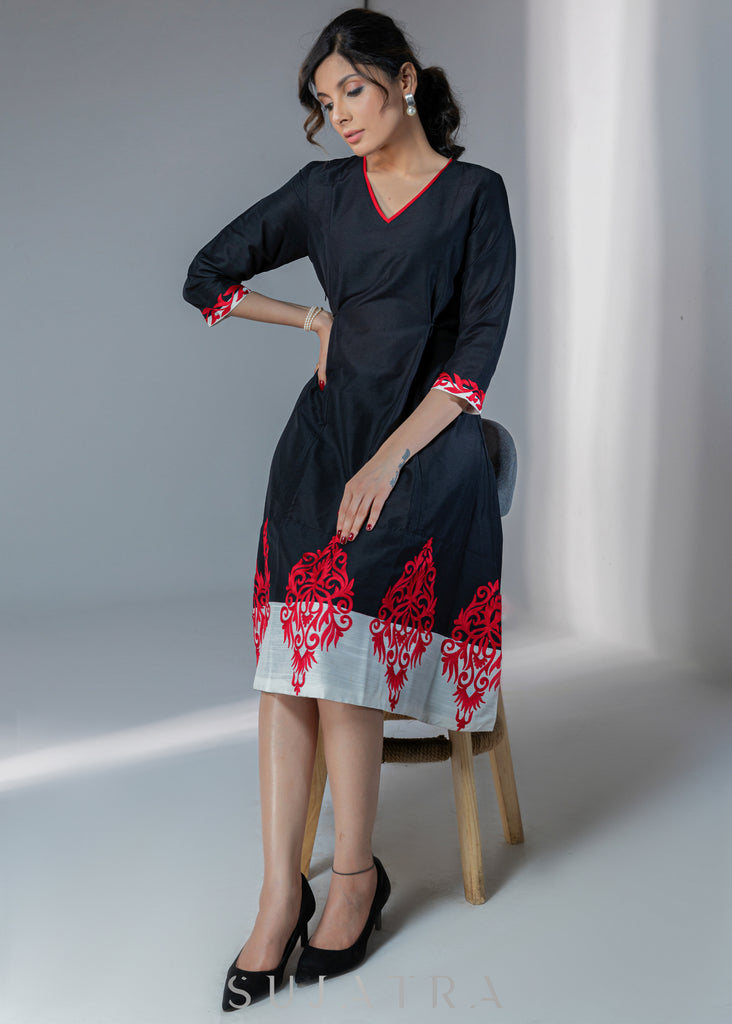 Black cotton silk dress with red embroidery motifs on hem