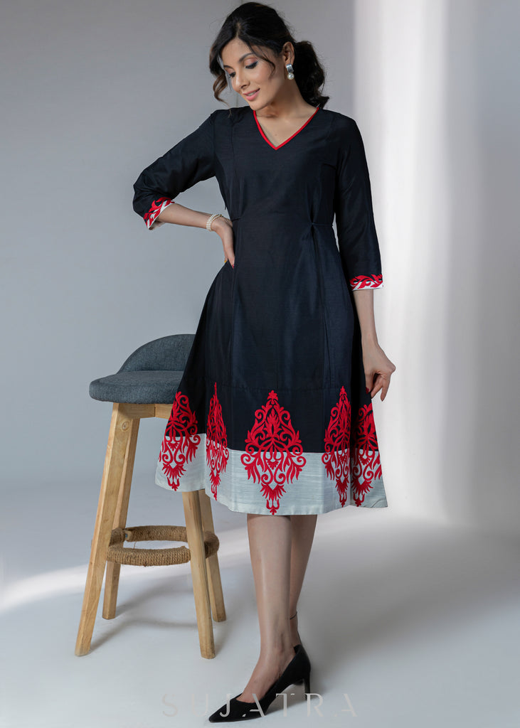 Black cotton silk dress with red embroidery motifs on hem