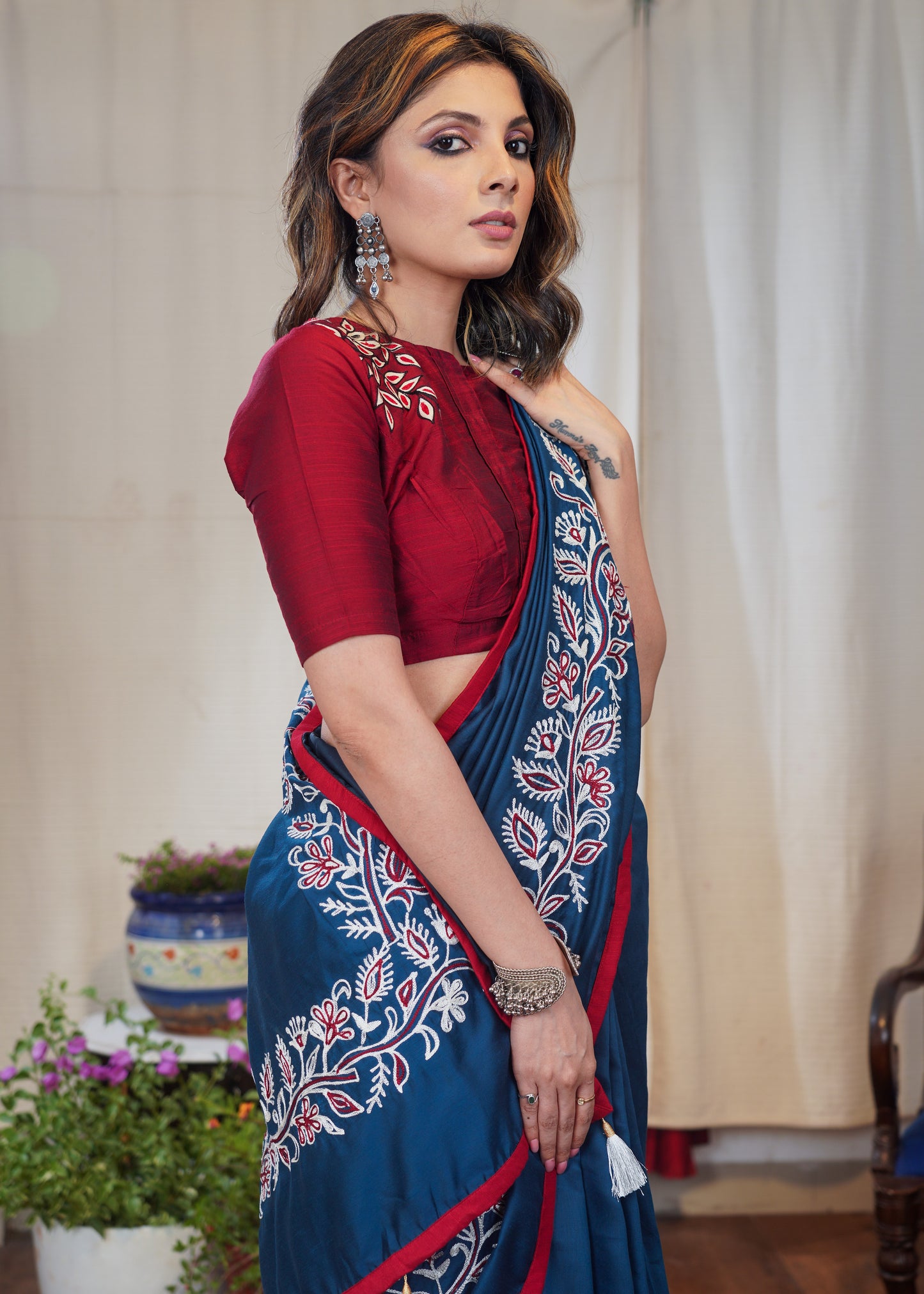 Teal exclusive machine embroidery Rayon saree with maroon border