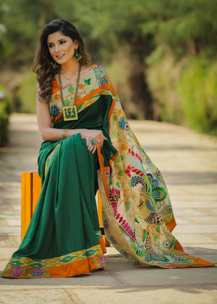 Dark green crepe satin saree with embroidered madhubani pallu