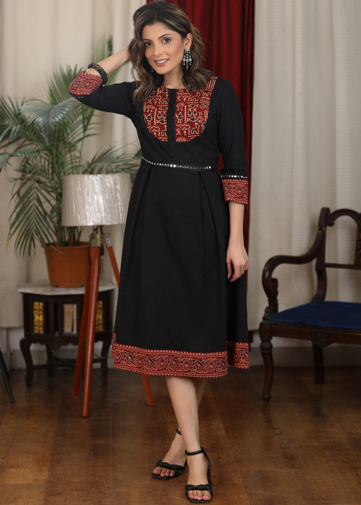 Black cotton flared dress with ajrakh combination highlighted with mirror lace