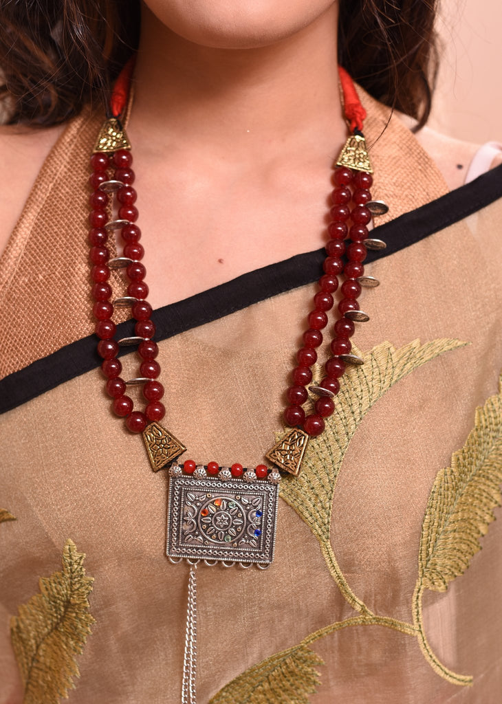Maroon glass beaded necklace with german silver pendant - Sujatra