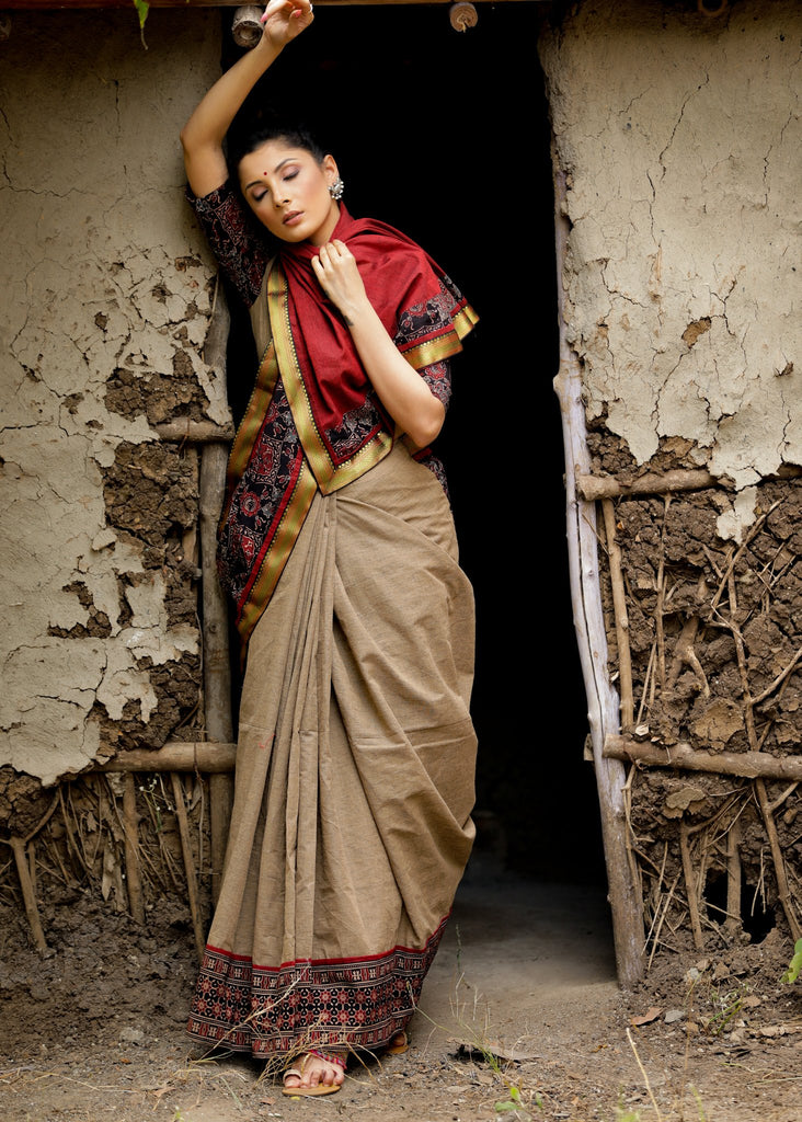 Beige handloom cotton and block printed ajrakh combination saree with traditional zari border