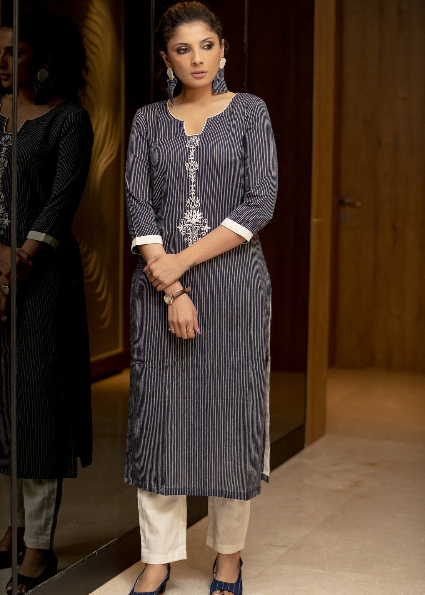 Navy blue pin striped straight cotton kurta with embroidery in front