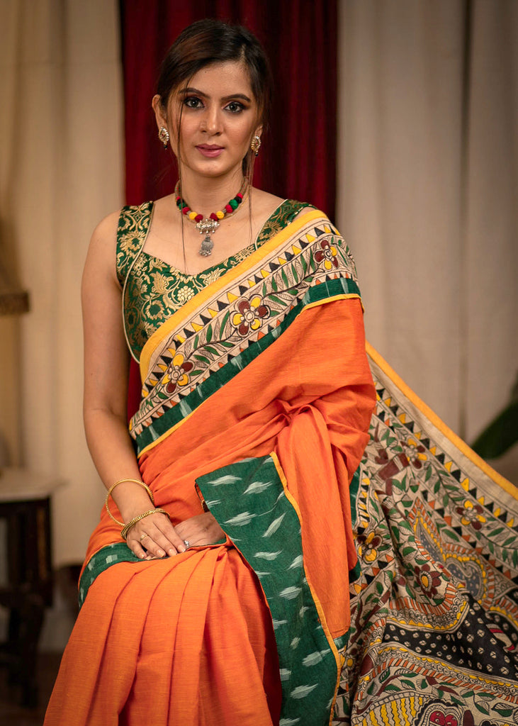 Orange handloom cotton saree with hand painted madhubani pallu and ikat border