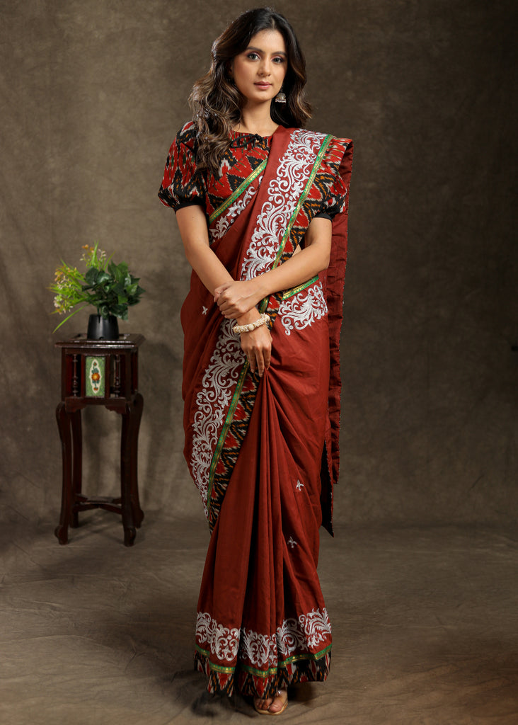 Brown Rayon saree with delicate embroidery and Ajrakh border
