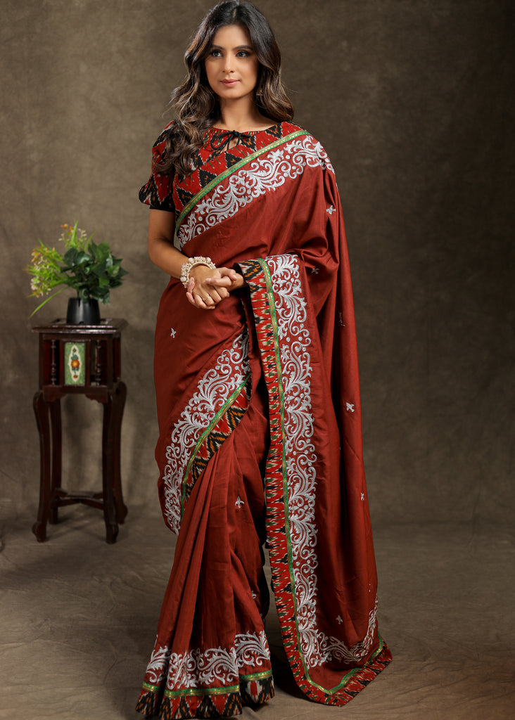 Brown Rayon saree with delicate embroidery and Ajrakh border