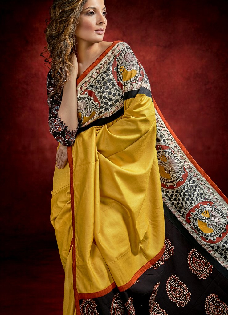 Mustard tussar staple silk saree with hand painted Madhubani border & Ajrakh pallu