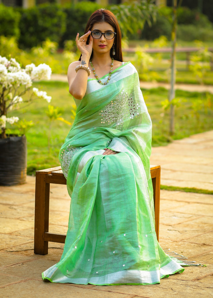 Exclusive pure silk linen pista green  cutwork saree with mirror work embellishments