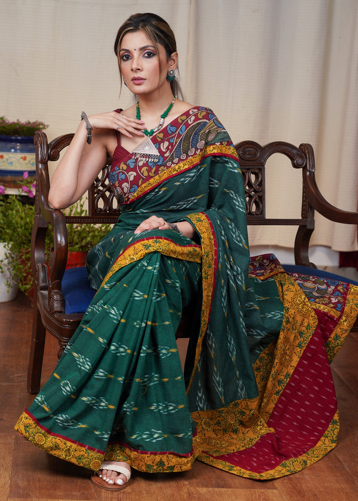 Elegant green Ikaat cotton saree with exclusive hand painted Kalamkari border