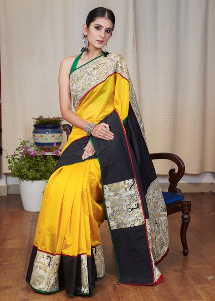 Yellow Chanderi saree with the combination of Madhubani print and black cotton silk border