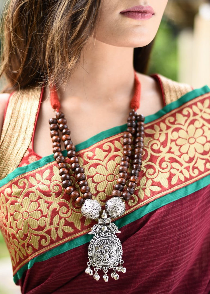 Exclusive double layered wooden beaded ethnic necklace with german silver pendant - Sujatra