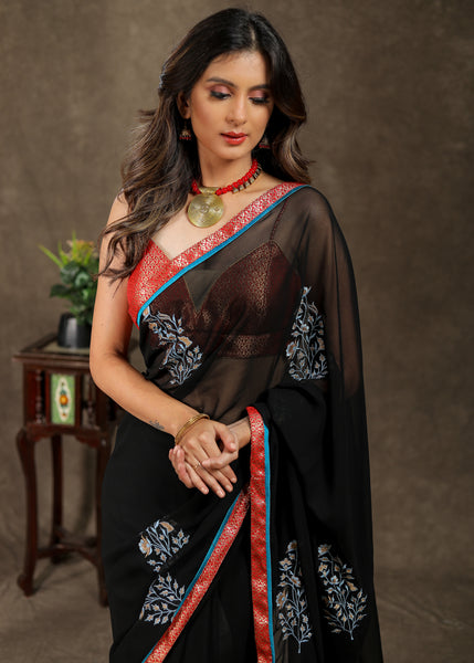 Classy black Georgette saree with embroidery motif and Banarasi pallu