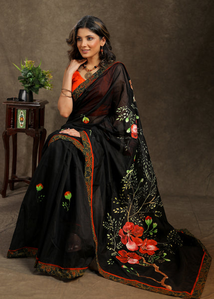 Graceful black Cotton hand painted saree with Ajrakh border
