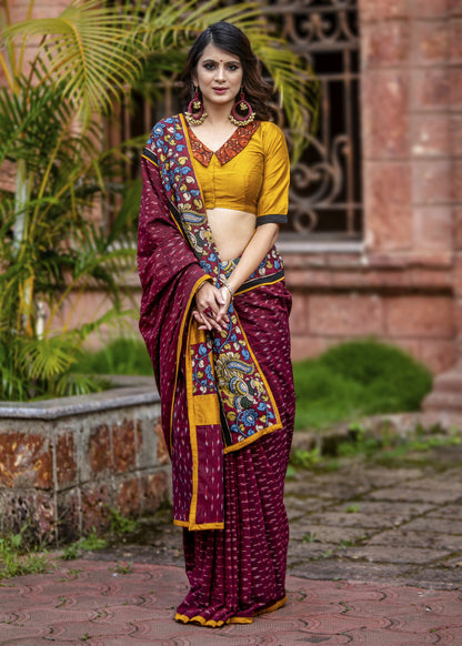 Exclusive maroon ikat saree with hand painted kalamkari border